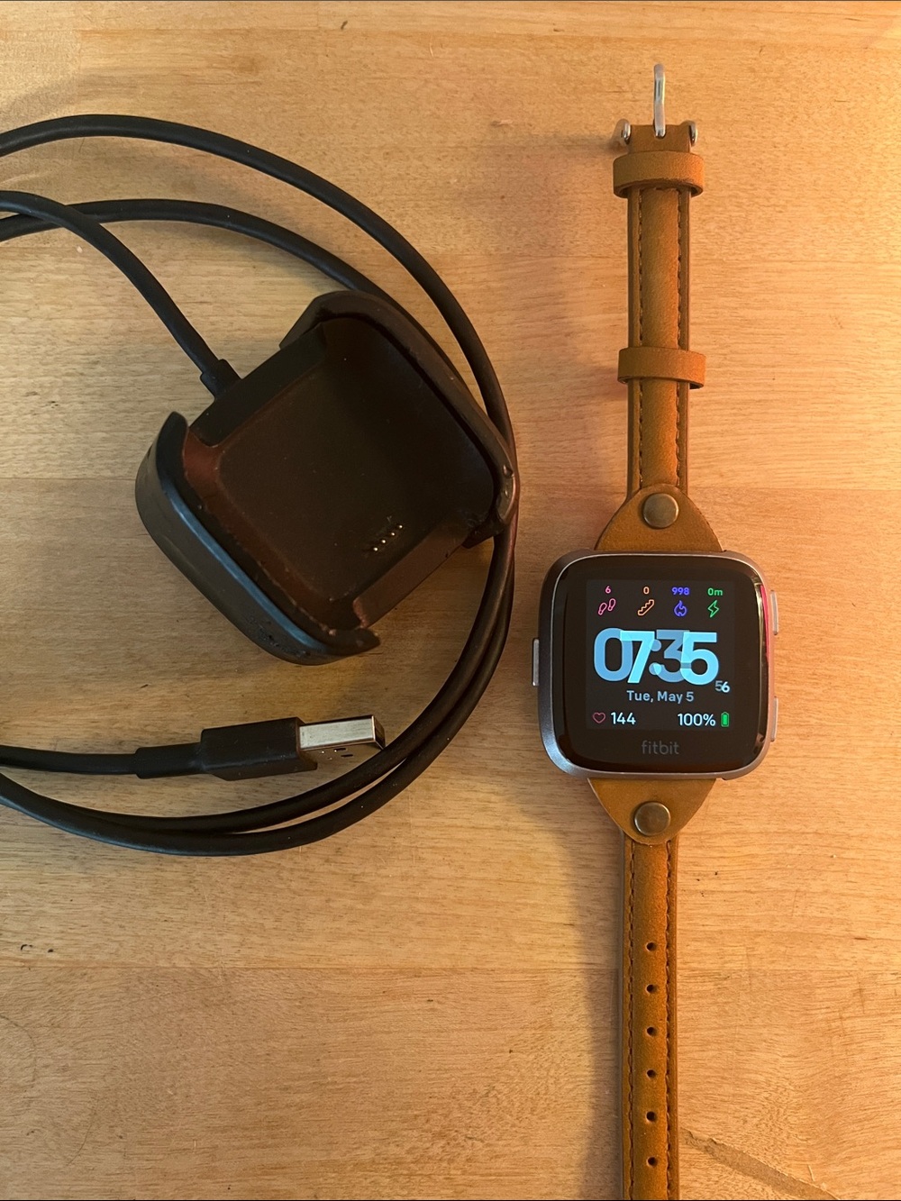 fitbit Versa with Leather Strap and Black Charger